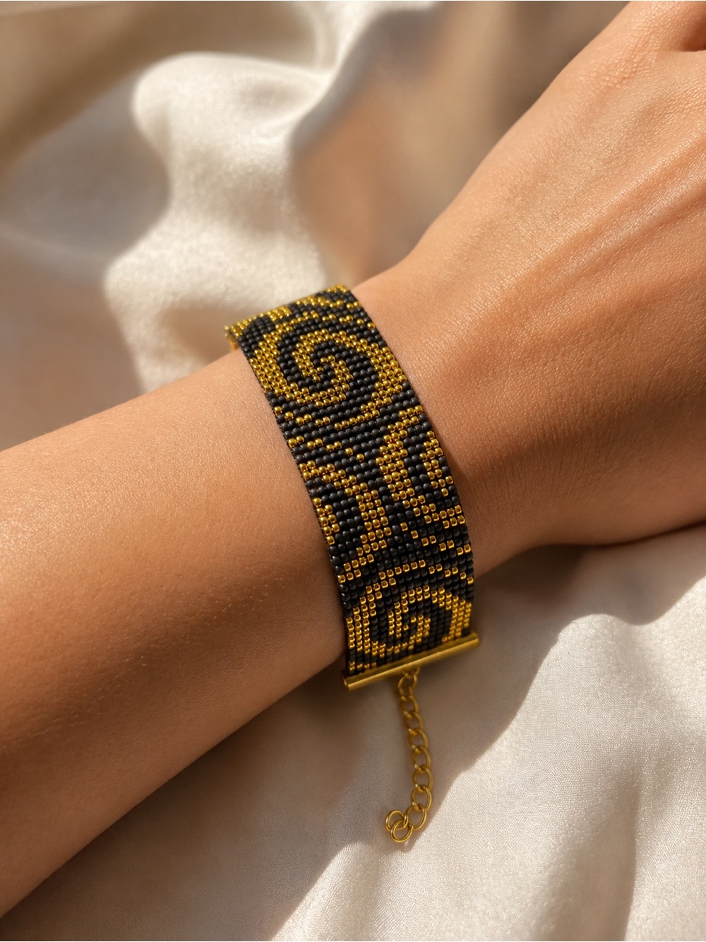 Handwoven Black and Gold Beaded Bracelet - Elegant Swirl Design